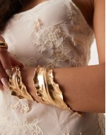 Limited Edition cuff bracelet with wrap around leaf detail in gold tone