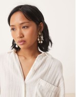 drop earrings in sun design with bead detail in gold tone