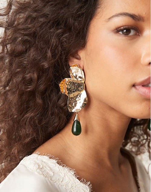 drop earrings in petal design with bead in gold tone